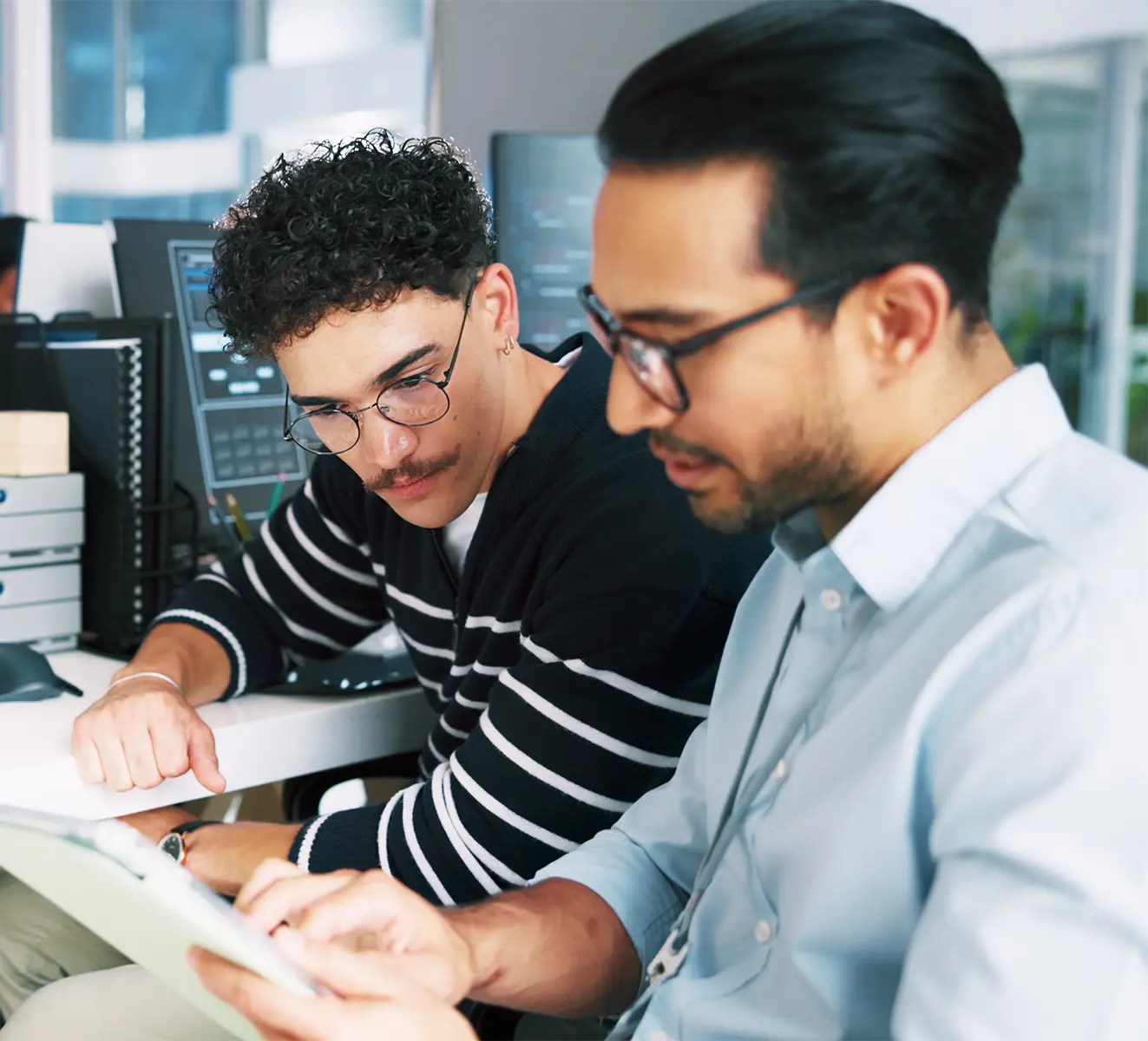 Two software developers reviewing data.