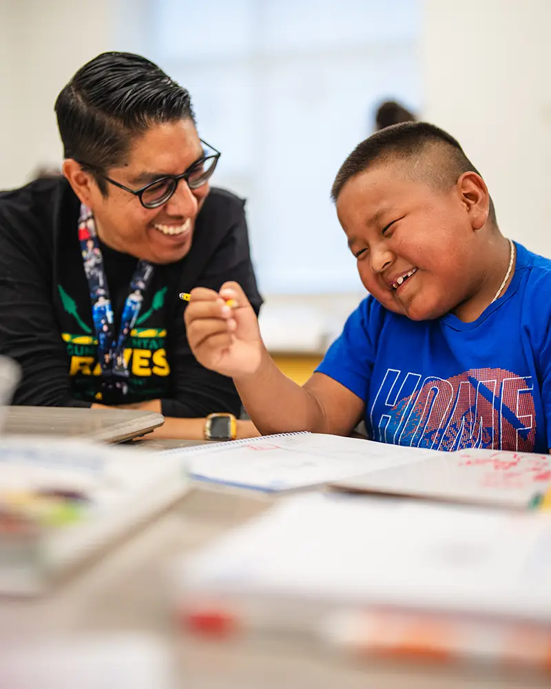 Reading mentor and a student having a laugh