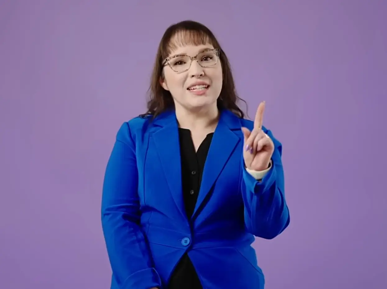 Woman answering questions as part of the Measles vaccination campaign.